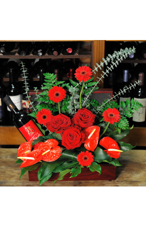 floral arrangement of flowers in a basket with wine - CELL 24010