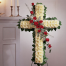 Cross funeral floral arrangement of roses and dahlias - COND 39004